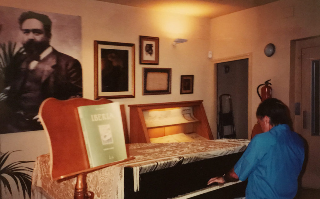 Marc Sherman at the piano in formal performance attire